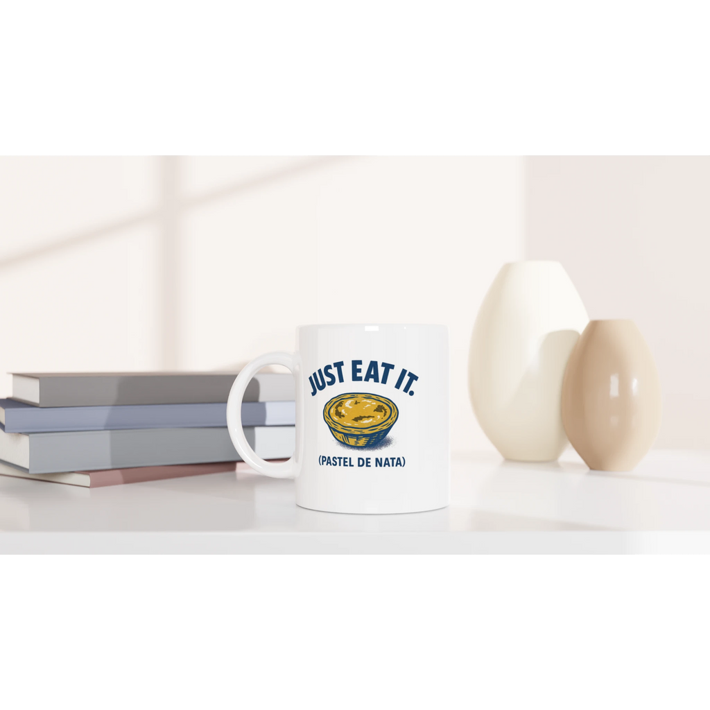 White ceramic mug with pastel de nata illustration and text “Just Eat It – Pastel de Nata”