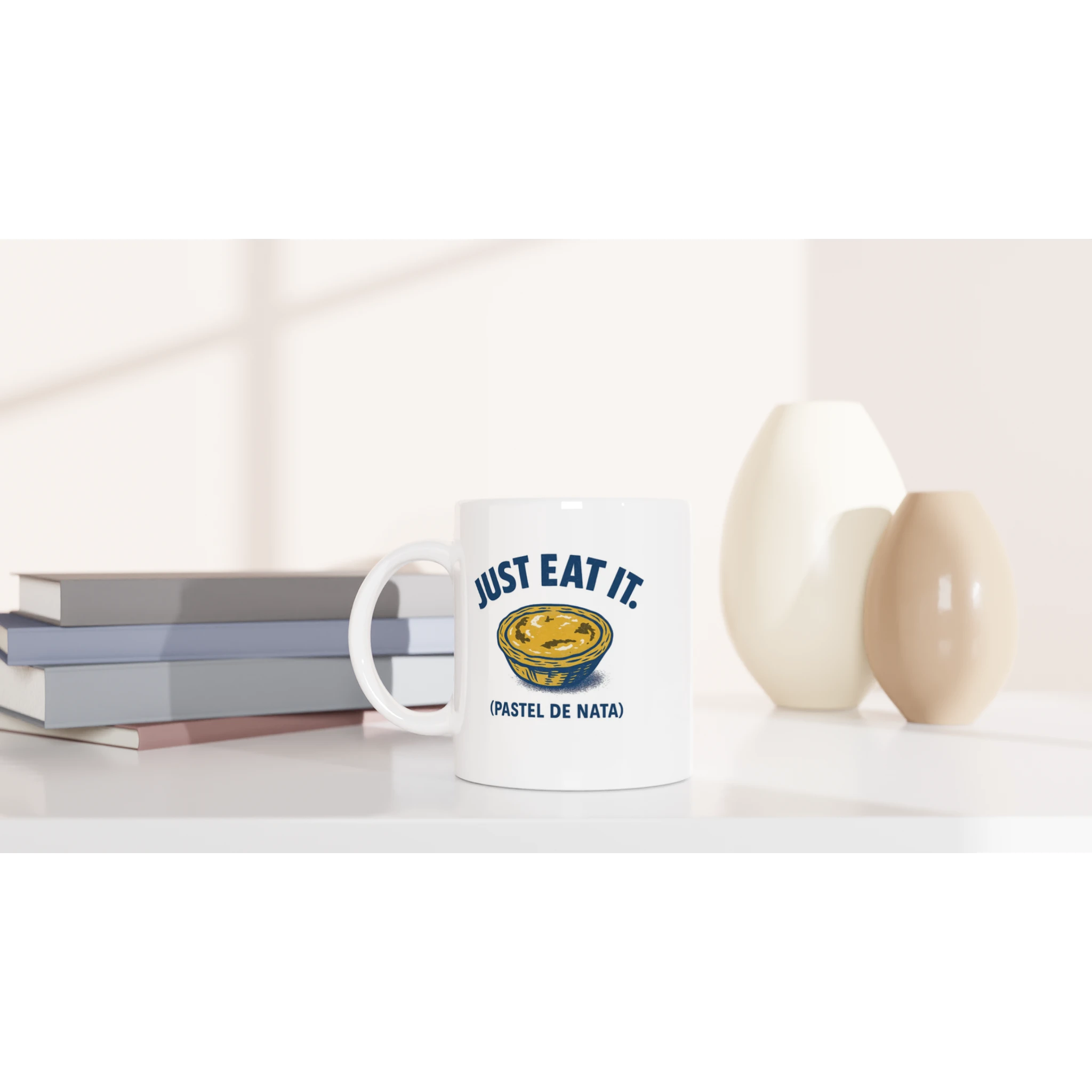 White ceramic mug with pastel de nata illustration and text “Just Eat It – Pastel de Nata”